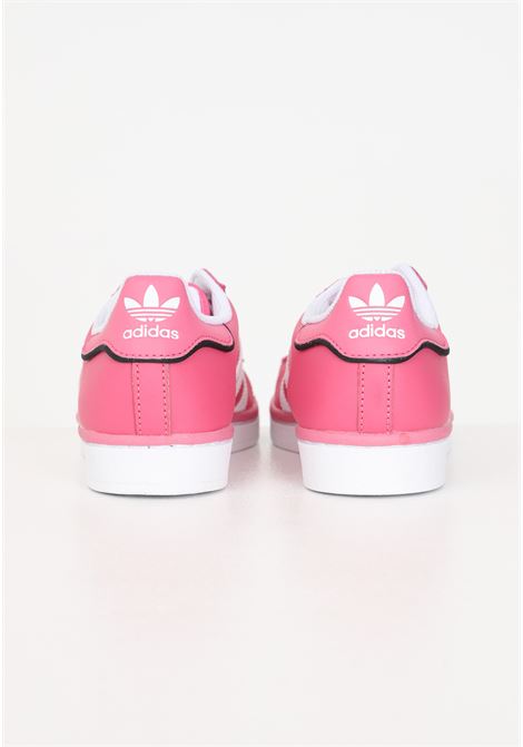 Pink women's sneakers with 3 white SUPERSTAR stripes ADIDAS ORIGINALS | IE0863.